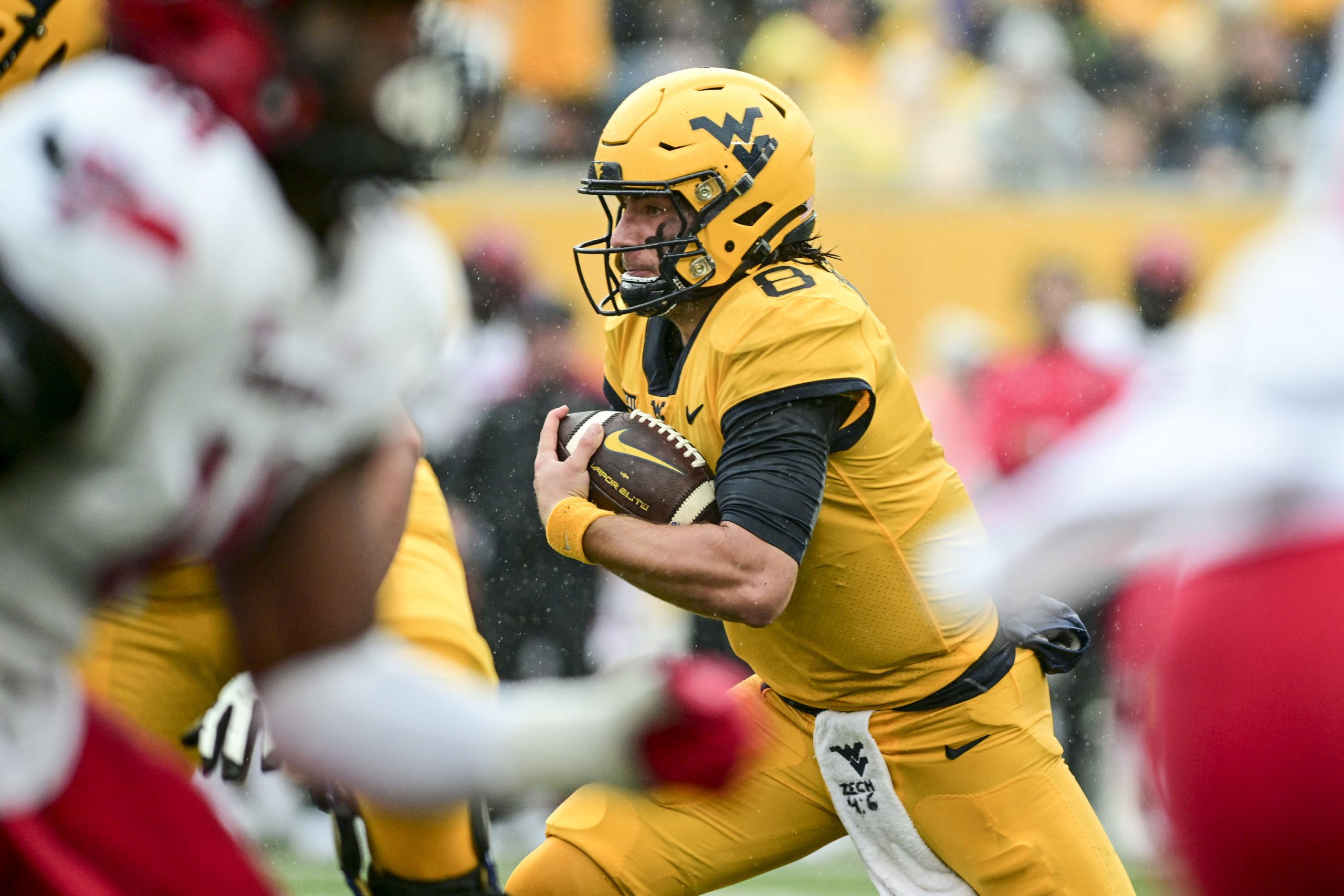 West Virginia's quarterback still undecided, Rich Rodriguez isn't concerned about position
